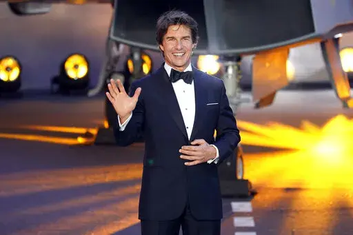 Tom Cruise poses for the media during the 'Top Gun Maverick' UK premiere at a central London cinema, on Thursday, May 19, 2022. (AP Photo/Alberto Pezzali)