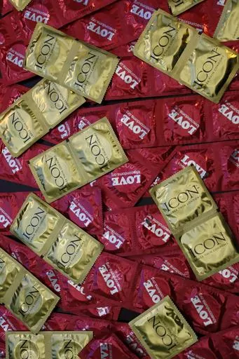 A sample of condoms distributed freely by the AIDS Healthcare Foundation is displayed at a news conference on Feb. 14, 2023, in Los Angeles. On Sunday, Oct. 8, 2023, California Gov. Gavin Newsom vetoed a bill that would have required free condoms be made available to all public high school students. (AP Photo/Damian Dovarganes, File)