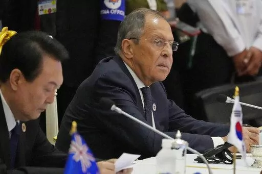 Sitting next to South Korea President Yoon Suk Yeol, left, Russian Foreign Minister Sergey Lavrov listens during the ASEAN Australia-New Zealand Trade Area (AANZTA) in Phnom Penh, Cambodia, Sunday, Nov. 13, 2022.  Lavrov has been taken to the hospital after suffering a health problem following his arrival for the Group of 20 summit in Bali, Indonesian authorities said Monday. (AP Photo/Heng Sinith, File)