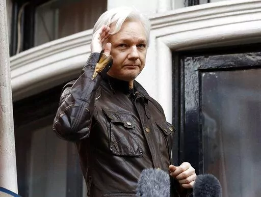 WikiLeaks founder Julian Assange greets supporters from a balcony of the Ecuadorian embassy in London, May 19, 2017. Britain’s top court on Monday March 14, 2022, refused WikiLeaks founder Julian Assange permission to appeal against a decision to extradite him to the U.S. to face spying charges. (AP Photo/Frank Augstein, File)