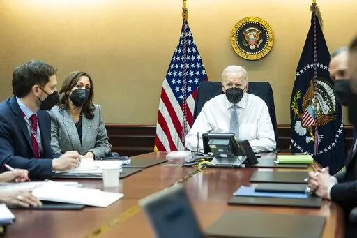 In this image provided by The White House, President Joe Biden and Vice President Kamala Harris and members of the President's national security team observe from the Situation Room at the White House in Washington, on Feb. 2, 2022, the counterterrorism operation responsible for removing from the battlefield Abu Ibrahim al-Hashimi al-Qurayshi, the leader of the Islamic State group. Biden and top national security officials have cited the recent strike killing al-Qaida head Ayman al-Zawahri as ev