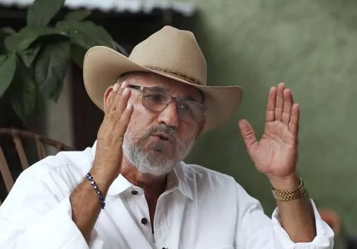 Hipolito Mora, founder of the state's civilian armed self-defense movement, speaks during an interview at his home in Ruana, Michoacan state, Mexico, Oct. 3, 2019. Mora has been killed on Thursday, June 29, 2023, in a successful attempt on his life. (AP Photo/Marco Ugarte, File)