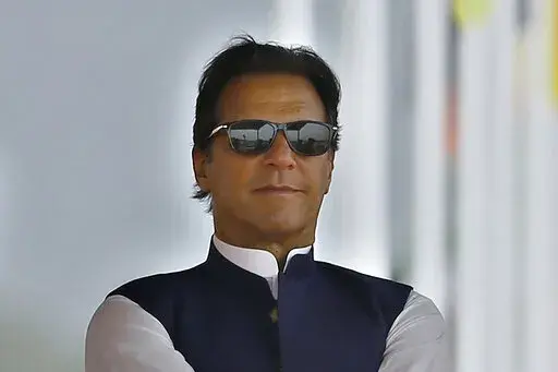 Pakistan's Prime Minister Imran Khan attends a military parade to mark Pakistan National Day, in Islamabad, Pakistan on March 23, 2022. Pakistan’s embattled prime minister faces a tough no-confidence vote Saturday, April 9, 2022, waged by his political opposition, which says it has the numbers to defeat him. (AP Photo/Anjum Naveed, File)