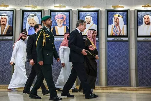 Saudi Arabia's Foreign Minister Prince Faisal bin Farhan bin Abdullah, right, and U.S. Secretary of State Antony Blinken, second right, walk to a Joint Ministerial Meeting of the GCC-U.S. Strategic Partnership to discuss the humanitarian crises faced in Gaza, in Riyadh, Saudi Arabia, Monday April 29, 2024. (Evelyn Hockstein/Pool via AP)