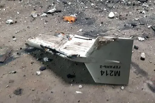 This undated photograph released by the Ukrainian military's Strategic Communications Directorate shows the wreckage of what Kyiv has described as an Iranian Shahed drone downed near Kupiansk, Ukraine. As protests rage at home, Iran's theocratic government is increasingly flexing its military muscle abroad. That includes supplying drones to Russia that now kill Ukrainian civilians, running drills in a border region with Azerbaijan and bombing Kurdish positions in Iraq. (Ukrainian military's Stra