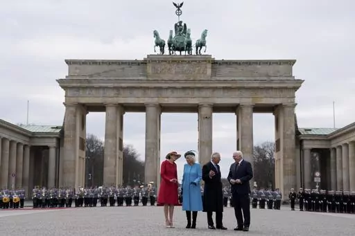 German President Frank-Walter Steinmeier, right, and his wife Elke Buedenbender, left, welcome Britain's King Charles III and Camilla, the Queen Consort, in front of the Brandenburg Gate in Berlin, Wednesday, March 29, 2023. King Charles III arrived Wednesday for a three-day official visit to Germany. (AP Photo/Matthias Schrader)