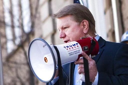 Former Nevada Assemblyman Jim Marchant addresses a crowd in front of the Nevada Capitol, Thursday March 4, 2021, in Carson, City, Nev., where the Nevada GOP delivered what they described as 120,000 "election integrity violations reports" alleging widespread voter fraud during the 2020 election. Of the seven Republicans running to oversee elections in this political battleground state, Marchant stands out for his full-throated embrace of conspiracy theories and lies about the 2020 election and hi