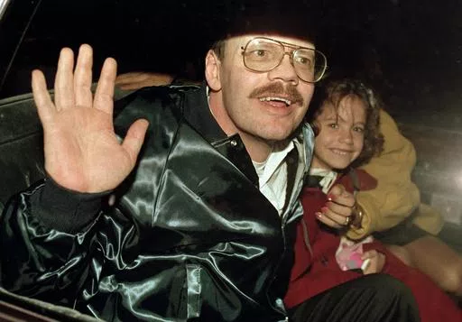 Terry Anderson, who was the longest held American hostage in Lebanon, grins with his 6-year-old daughter Sulome, Dec. 4, 1991, as they leave the U.S. Ambassador's residence in Damascus, Syria, following Anderson's release. Anderson, the globe-trotting Associated Press correspondent who became one of America’s longest-held hostages after he was snatched from a street in war-torn Lebanon in 1985 and held for nearly seven years, died Sunday, April 21, 2024. He was 76. (AP Photo/Santiago Lyon, Fil