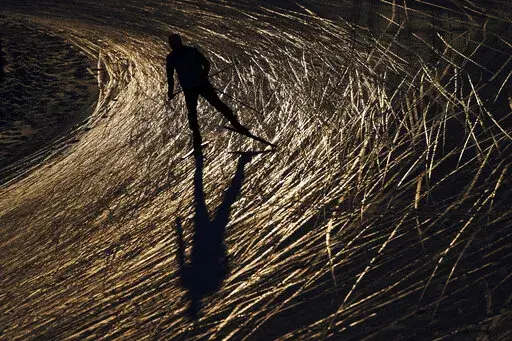 A skier trains during a cross-country skiing training session at the 2022 Winter Olympics, Monday, Feb. 14, 2022, in Zhangjiakou, China. (AP Photo/John Locher)