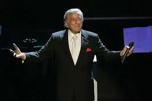 Tony Bennett reacts after performing the song "I left My Heart in San Francisco" during his 80th birthday celebration at the Kodak Theater in Los Angeles, on Nov. 9, 2006. Bennett, the eminent and timeless stylist whose devotion to classic American songs and knack for creating new standards, graced a decadeslong career that brought him admirers from Frank Sinatra to Lady Gaga, died Friday, July 21, 2023. He was 96. (AP Photo/Kevork Djansezian, File)