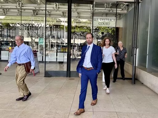 Stephen Tyler Bieneman walks out of a U.S. courthouse after the first day of his trial in Honolulu, Monday, Nov. 6, 2023. Bieneman has pleaded not guilty to assault after a woman accused of him assaulting her in Antarctica. (AP Photo/Jennifer Sinco Kelleher)