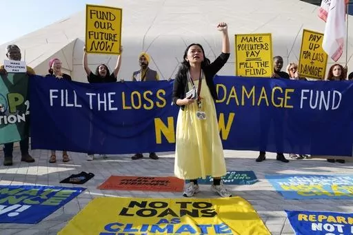 Activists participate in a demonstration for loss and damage at the COP28 U.N. Climate Summit, Monday, Dec. 4, 2023, in Dubai, United Arab Emirates. (AP Photo/Kamran Jebreili, File)