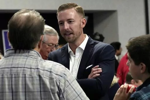 Ryan Walters, Republican candidate for state superintendent of public instruction, talks with supporters at a Republican watch party Nov. 8, 2022, in Oklahoma City. Walters is a strong supporter of a voucher-style plan that would allow parents to use taxpayer money to homeschool their children or send them to private schools, even religious ones. (AP Photo/Sue Ogrocki, File)