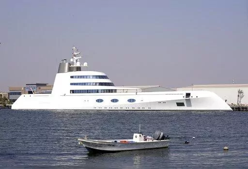 The 118-meter (387-foot) Motor Yacht A belonging to  Russian oligarch Andrey Melnichenko is anchored in the port of Ras al-Khaimah, United Arab Emirates, Tuesday, May 31, 2022. In the dusty, northern-most sheikhdom of the United Arab Emirates, Motor Yacht A, one of the world's largest yachts, sits in the quiet port — so far avoiding the fate of other luxury vessels linked to sanctioned Russian oligarchs. (AP Photo/Kamran Jebreili)
