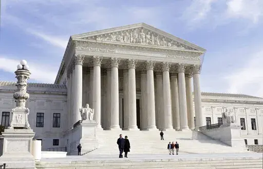This photo shows the U.S. Supreme Court Building, Wednesday, Jan. 25, 2012 in Washington. A draft opinion circulated among Supreme Court justices suggests that a majority of high court has thrown support behind overturning the 1973 case Roe v. Wade that legalized abortion nationwide, according to a report published Monday night, May 2, 2022 in Politico. (AP Photo/J. Scott Applewhite, File)