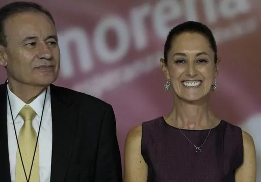Mexican politicians Alfonso Durazo, left, and presumptive MORENA party presidential candidate Claudia Sheinbaum stand together during an event to announce the next party candidate in Mexico City, Wednesday, Sept. 6, 2023. (AP Photo/Fernando Llano)