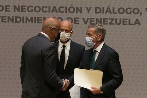 Venezuelan President of the National Assembly Jorge Rodriguez, left, shakes hands with Venezuelan opposition delegate Gerardo Blyde Perez in Mexico City, Aug. 13, 2021. Venezuela’s government and opposition will resume their dialogue, mediated by Norway, with talks scheduled for Tuesday, Oct. 17,2023 in Barbados, Norway’s embassy in Mexico said on Oct. 16, 2023 in a brief statement. (AP Photo/Marco Ugarte, File)