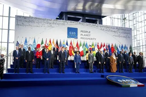 President Joe Biden, bottom left, poses with other leaders for the family photo of the G20 summit at the La Nuvola conference center, in Rome, Oct. 30, 2021. Despite Russia's invasion of Ukraine, Moscow's membership in the Group of 20 remains firmly intact. And while it has been rendered a pariah country by Western states, Russia will remain a member unless countries achieve consensus to remove it. That appears less and less likely, as several countries, including China, South Africa and India, 