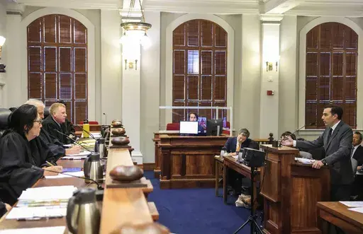 Attorney Jesse Max Creed, right, speaks during a Hawaii Supreme Court hearing in Honolulu, Thursday, Feb. 6, 2025, regarding settlements related to the 2023 Lahaina wildfires. (Jamm Aquino/Honolulu Star-Advertiser via AP, Pool)