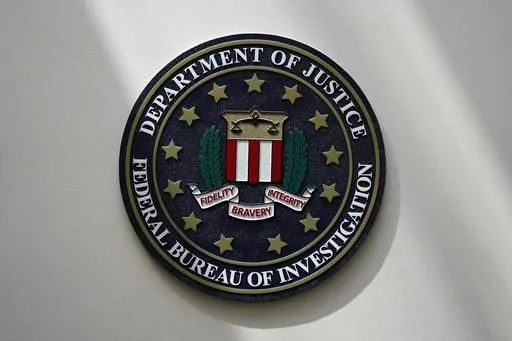 The FBI seal is pictured in Omaha, Neb., Aug. 10, 2022. A White House advisory board is calling for major changes in how the FBI uses a controversial foreign surveillance tool. The President’s Intelligence Advisory Board issued a report Monday, July 31, 2023, with new recommendations related to Section 702 of the Foreign Intelligence Surveillance Act. (AP Photo/Charlie Neibergall, File)