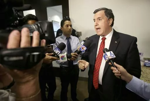 Former Doral, Fla., City Manager Joe Carollo, gestures as he talks to members of the media after being fired by the City Council on April 28, 2014 in Doral. A federal jury in South Florida awarded $63.5 million on Thursday, June 1, 2023, to a pair of businessmen who claimed Miami City Commissioner Carollo used his office to harass them after they supported the commissioner's political opponent. (AP Photo, File)