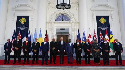 President Joe Biden, center, poses for a photo with Pacific Island leaders on the North Portico of the White House in Washington, Sept. 29, 2022. From left, New Caledonia President Louis Mapou, Tonga Prime Minister Siaosi Sovaleni, Palau President Surangel Whipps Jr., Tuvalu Prime Minister Kausea Natano, Micronesia President David Panuelo, Fiji Prime Minister Josaia Voreqe Bainimarama, Biden, Solomon Islands Prime Minister Manasseh Sogavare, Papua New Guinea Prime Minister James Marape, Marshall