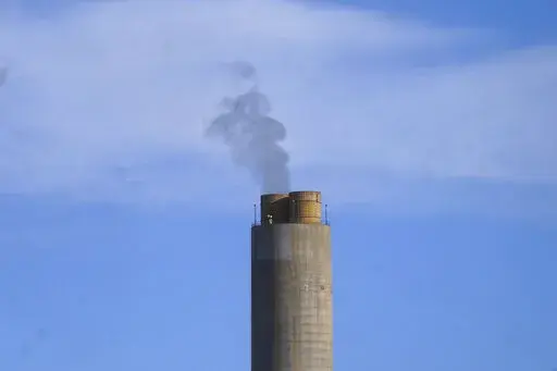 A smokestack stands at a coal plant on Wednesday, June 22, 2022, in Delta, Utah. On Monday, Sept. 19, the world’s first public database of fossil fuel production, reserves and emissions launches.  It shows that the United States and Russia have enough fossil fuel reserves to exhaust the world’s remaining carbon budget to stay under 1.5 degrees Celsius warming. (AP Photo/Rick Bowmer, File)