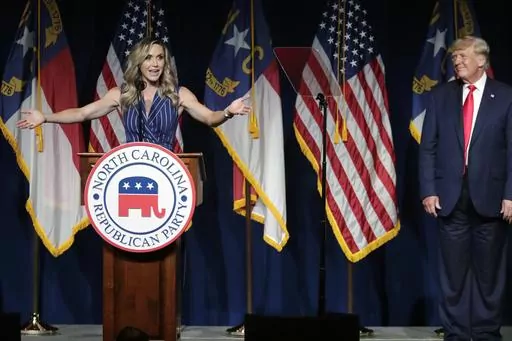 Former President Donald Trump, right, listens as his daughter-in-law Lara Trump speaks at the North Carolina Republican Convention, June 5, 2021, in Greenville, N.C. Donald Trump is calling for a shakeup at the highest levels of the Republican National Committee. And party leaders are taking it very seriously. (AP Photo/Chris Seward, Fike)
