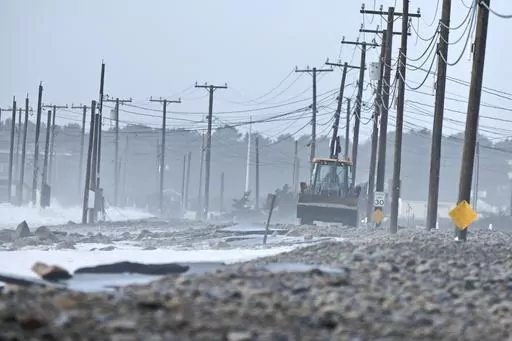 The remnants of East Beach Road are damaged after heavy overnight winds and surf battered the coastline, Wednesday, Jan. 10, 2024 in Westport, Mass. Salisbury, Mass., is scrambling after a weekend storm washed away mountains of sand trucked in for nearly $600,000 dune that was meant to protect homes, roads and other infrastructure. The community and other areas of Massachusetts also were hit by severe storms in January, including flooding, erosion, and infrastructure damage. (Peter Pereira/The S
