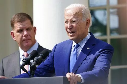 President Joe Biden, with Secretary of Labor Marty Walsh, left, speaks about a tentative railway labor agreement in the Rose Garden of the White House, Thursday, Sept. 15, 2022, in Washington. (AP Photo/Susan Walsh)