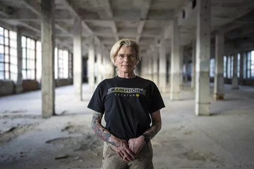 Ukrainian medic Yuliia Paievska, known as Taira, poses for a photograph during an interview with The Associated Press in Kyiv, Ukraine, on Friday, July 8, 2022. The celebrated Ukrainian medic who was held captive by Russian forces says she thinks about the prisoners she left behind constantly. Before she was captured, Paievska had recorded harrowing bodycam footage showing her team's efforts to save the wounded in the besieged city of Mariupol. (AP Photo/Evgeniy Maloletka)