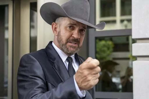 Otero County, New Mexico Commissioner Couy Griffin speaks to reporters at federal court in Washington, June. 17, 2022. The Supreme Court has rejected an appeal by a former New Mexico county commissioner banished from public office for participating in the Jan. 6 Capitol insurrection. The court’s order Monday means former Otero County commissioner Couy Griffin remains disqualified from public office under a constitutional provision designed to prevent ex-Confederates from serving in government 