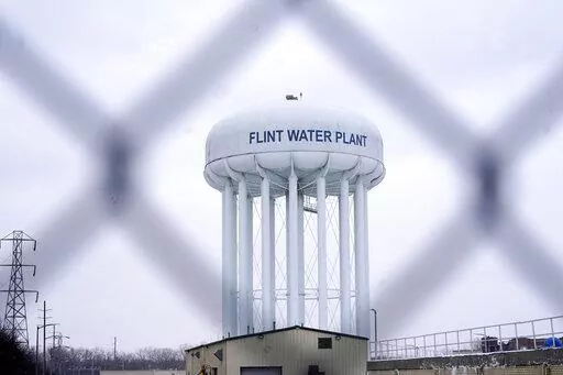 The Flint water plant tower is pictured on Jan. 6, 2022, in Flint, Mich. A judge dismissed criminal charges against former Michigan Gov. Rick Snyder in the Flint water crisis, months after the state Supreme Court said indictments returned by a one-person grand jury were invalid. (AP Photo/Carlos Osorio, File)