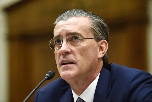 U.S. Special Representative for Afghanistan and Pakistan Richard Olson testifies on Capitol Hill in Washington on Dec. 16, 2015. Olson, who has signed a plea deal with prosecutors in January, is pushing federal prosecutors explain why he’s facing criminal charges for illegal foreign lobbying on behalf of Qatar while a retired four-star general who worked with him on the effort is not. (AP Photo/Susan Walsh, File)