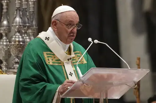 Pope Francis celebrates Mass on the Day of the Poor in St. Peter's Basilica, at the Vatican, Sunday, Nov. 14, 2021. (AP Photo/Gregorio Borgia)