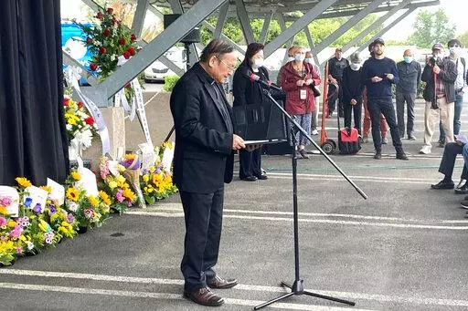 Pastor Albany Lee addresses congregants and community members on Saturday, May 21, 2022, as survivors and church leaders join in prayer and thank community members for their support nearly a week after a deadly shooting at a Taiwanese American church congregation in Laguna Woods, Calif. The community is reeling after the attack on a luncheon of the Irvine Taiwanese Presbyterian Church that killed one and wounded five. Lee said trauma specialists will be available to assist community members. (AP