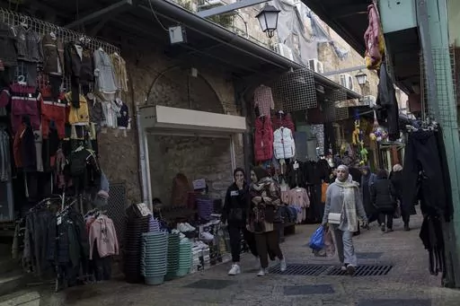 Muslim women walk through a market, ahead of the holy Islamic month of Ramadan, in the Old City of Jerusalem, Thursday, March 7, 2024. Restrictions put in place amid the Israel-Hamas war have left many Palestinians concerned they might not be able to pray at Al-Aqsa Mosque compound, which is revered by Muslims. (AP Photo/Leo Correa, File)