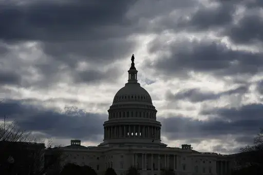 The Capitol in Washington, is framed by early morning clouds, March 19, 2024. Congress has until midnight Friday to come up with a way to fund the government, or federal agencies will shutter. It's up to each federal agency to determine how it handles a shutdown, but there would be disruptions in many services. (AP Photo/J. Scott Applewhite, File)