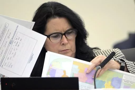 State Sen. Kelli Stargel looks through redistricting maps during a Senate Committee on Reapportionment hearing on Jan. 13, 2022, in Tallahassee, Fla. A Florida redistricting plan pushed by Gov. Ron DeSantis violates the state constitution and is prohibited from being used for any future U.S. congressional elections since it diminishes the ability of Black voters in north Florida to pick a representative of their choice, a state judge ruled Saturday, Sept. 2, 2023. (AP Photo/Phelan M. Ebenhack, F