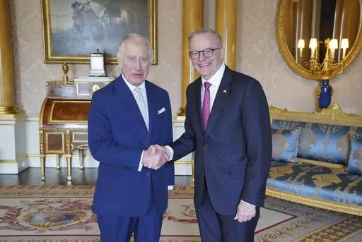 King Charles III, left, receives Australian Prime Minister Anthony Albanese, right, during an audience at Buckingham Palace in London, Britain, Tuesday May 2, 2023. (Jonathan Brady/Pool via AP)