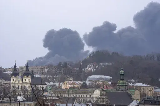 Smoke rises in the air in Lviv, western Ukraine, Saturday, March 26, 2022. With Russia continuing to strike and encircle urban populations, from Chernihiv and Kharkiv in the north to Mariupol in the south, Ukrainian authorities said Saturday that they cannot trust statements from the Russian military Friday suggesting that the Kremlin planned to concentrate its remaining strength on wresting the entirety of Ukraine's eastern Donbas region from Ukrainian control. (AP Photo/Nariman El-Mofty)