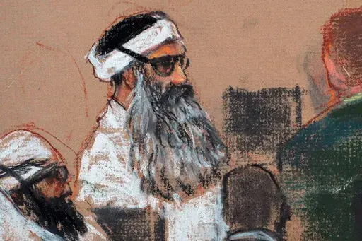 This Monday, Dec. 8, 2008 courtroom drawing by artist Janet Hamlin and reviewed by the U.S. military, shows Khalid Sheikh Mohammed, center, and co-defendant Walid Bin Attash, left, attending a pre-trial session at Guantanamo Bay Naval Base, Cuba. The man accused of being the main plotter in al-Qaeda's Sept. 11, 2001 attacks has agreed to plead guilty, The Defense Department said Wednesday. (AP Photo/Janet Hamlin, Pool, File)
