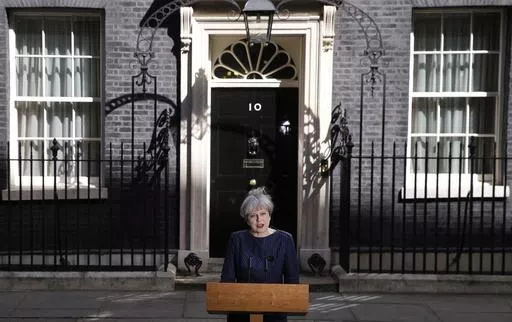 Britain's Prime Minister Theresa May speaks to the media outside her official residence of 10 Downing Street in London, Tuesday April 18, 2017. Theresa May, who succeeded David Cameron after he resigned following Britain's vote to leave the European Union in a referendum in June 2016, sought to capitalize on the Conservative Party's big opinion poll lead and called an early general election for June 2017. (AP Photo/Alastair Grant, File)