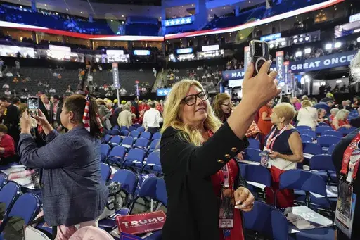 A delegate takes a selfie at the Republican National Convention Monday, July 15, 2024, in Milwaukee. (AP Photo/Nam Y. Huh)