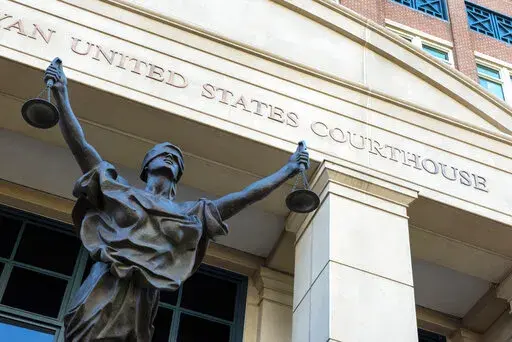 The U.S. Courthouse is seen in Alexandria, Va., Thursday, Sept. 2, 2021.   A woman who once lived in Kansas has been arrested after federal prosecutors charged her with joining the Islamic State group and leading an all-female battalion of AK-47 wielding militants. The U.S. Attorney in Alexandria, announced Saturday, Jan. 29, 2022, that 42-year-old Allison Fluke-Ekren has been charged with providing material support to a terrorist organization.  (AP Photo/Cliff Owen, File)