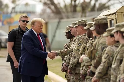 Republican presidential candidate former President Donald Trump greets members of the National Guard on the U.S.-Mexico border, Feb. 29, 2024, in Eagle Pass, Texas. Recent statements by Trump have fueled Democrats' sense that there's an opening among voters with strong military ties, and progressive veterans' organizations are working to bridge the gap with what has long been a reliably red constituency. (AP Photo/Eric Gay, File)