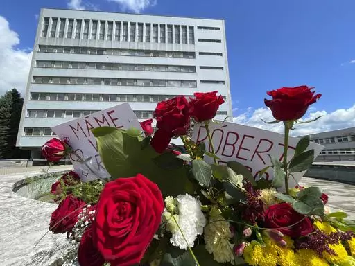 Flowers are placed outside the F. D. Roosevelt University Hospital, where Slovak Prime Minister Robert Fico, who was shot and injured, is being treated, in Banska Bystrica, central Slovakia, Saturday, May 18, 2024. The man accused of attempting to assassinate Slovak Prime Minister Robert Fico made his first court appearance Saturday as the nation's leader remained in serious condition recovering from surgery after surviving multiple gunshots, Slovak state media said. (AP Photo/Lefteris Pitarakis