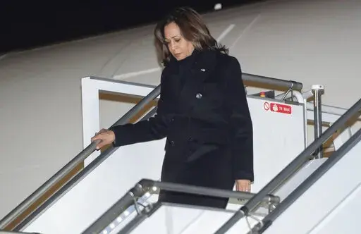 U.S. Vice President Kamala Harris disembarks from Air Force Two upon arrival at Warsaw Chopin Airport in Warsaw, Poland, Wednesday, March 9, 2022, as she travels on a 3-day trip to Poland and Romania for meetings about the war in Ukraine. (Saul Loeb/Pool via AP)