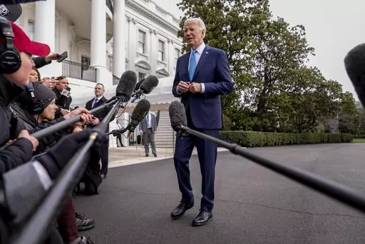 President Joe Biden speaks to members of the media before boarding Marine One on the South Lawn of the White House in Washington, Jan. 30, 2024. U.S. adults are only feeling slightly better about the economy, despite stocks being near record highs and surprisingly strong growth last year. A new poll from The Associated Press-NORC Center for Public Affairs Research finds that 35% of U.S. adults call the national economy good. (AP Photo/Andrew Harnik, File)