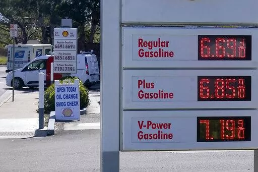 The gasoline price board is shown at a gas station in Menlo Park, Calif., March 21, 2022. A majority of Americans say they don't blame President Joe Biden for high gasoline prices, but they're giving his economic leadership low marks amid fears of inflation and deepening pessimism about economic conditions.(AP Photo/Jeff Chiu)